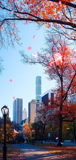 Autumn cityscape with vibrant orange leaves and city skyline against a blue sky.