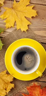 Autumn-themed wallpaper with a yellow coffee cup and vibrant fall leaves.