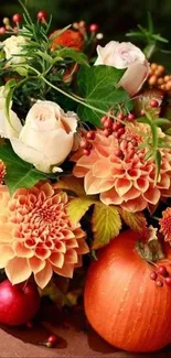 Elegant autumn floral arrangement with pumpkins and flowers.