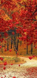 Scenic autumn forest with vibrant red foliage and winding path.