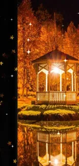 Orange autumn gazebo at night with starlit sky reflections on water.