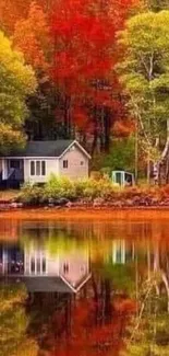 Serene lakeside cabin with autumn foliage and water reflection.