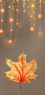 Autumn maple leaf with glowing lights on a soft brown background.