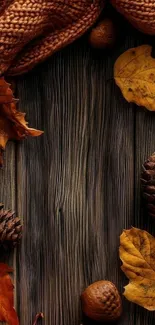 Autumn leaves and pinecones on a rustic wooden background.