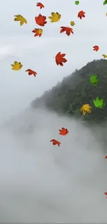 Vibrant autumn leaves falling over misty mountains, creating a serene natural scene.