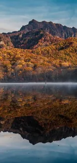 Beautiful autumn mountain and lake reflection in tranquil scenery.