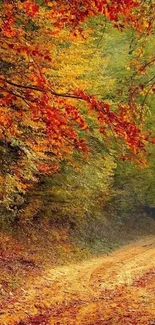 Autumn path with orange leaves in vibrant forest.