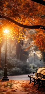 Glowing lamppost with autumn leaves and park bench.