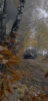 Tank on a forest path surrounded by autumn leaves.