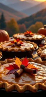 Pumpkin pies with autumn leaves and a sunset backdrop.