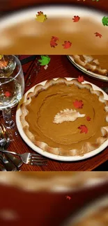 Pumpkin pie with autumn leaves and table setting wallpaper.