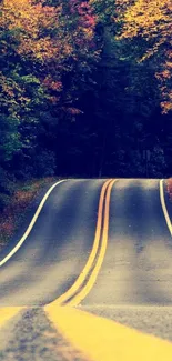 Scenic autumn road with vibrant fall foliage on a mobile wallpaper.