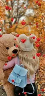 Girl hugging teddy bear amid autumn leaves and red hearts.