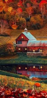 Autumn barn scene with vibrant foliage and pond reflection.