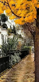 Vibrant autumn street with golden leaves and tranquil sidewalk.