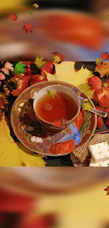 Autumn-themed wallpaper with tea and colorful leaves.