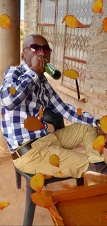 Person relaxing outdoors with autumn leaves.