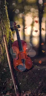 Violin leaning against a tree in a serene autumn forest with falling leaves.