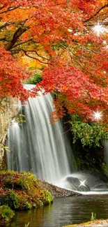 A serene waterfall surrounded by vibrant red autumn leaves sparkling with light.