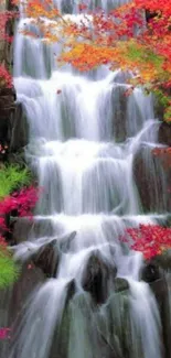 Cascading waterfall with vibrant autumn colors in a serene setting.