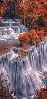 Beautiful waterfall surrounded by vibrant autumn foliage in a serene forest setting.