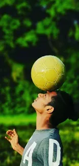 A football balanced on a person's head against a green, leafy background.