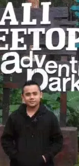 Person standing at Bali Treetop Adventure Park, lush surroundings.