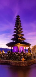 Bali temple at twilight with a purple sky and serene landscape.