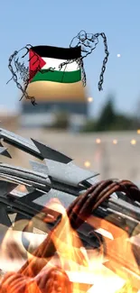 Barbed wire with a flag in the background against a blurred sky.