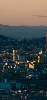 Barcelona cityscape at sunset with scenic skyline.