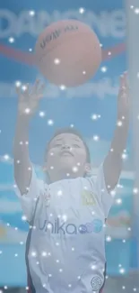 A child reaches for a basketball in a light blue-themed wallpaper.