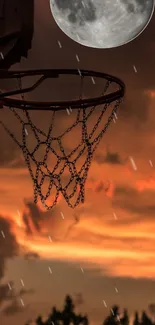 Basketball hoop silhouetted against a vibrant orange sunset sky with full moon.