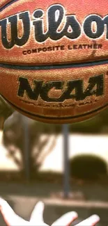 Wilson NCAA basketball in motion, perfect for sporty mobile wallpaper.