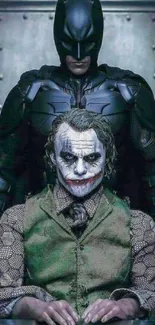 Batman stands behind Joker in dimly lit room.