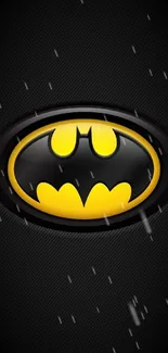 Batman emblem on dark background mobile wallpaper with black and yellow colors.