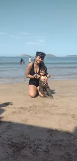 Family enjoying a sunny day at the beach with gentle waves in the background.