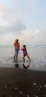 Family enjoying the beach with clear sky and gentle waves.