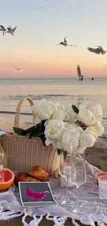 Peaceful beach picnic scene at sunset.