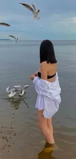 Serene beach scene with seagulls and ocean.