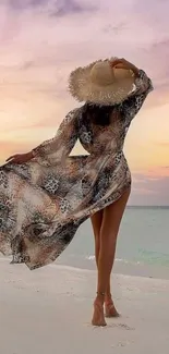 A woman in a flowing dress stands on a beach at sunset.