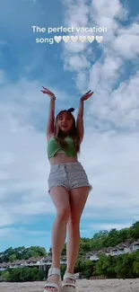 Girl on beach with clear sky, enjoying summer vacation vibes.