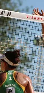 Beach volleyball players in action at the net.