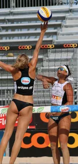 Athletes in action during a beach volleyball match.