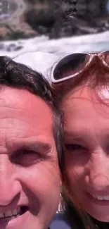 Smiling couple enjoying a sunny day at the beach.