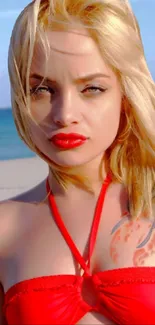 Woman in red swimsuit on beach with ocean in background.