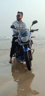 Man on motorcycle enjoying a beach ride with ocean view.