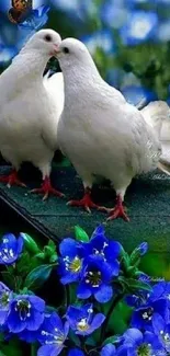 Two white doves among vibrant blue flowers in a serene setting.