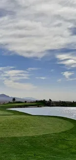 Tranquil golf course with green field and blue sky.