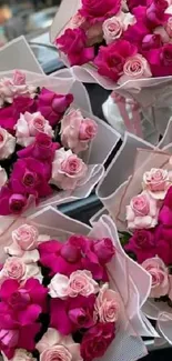 Five vibrant pink rose bouquets elegantly arranged.