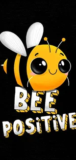 Cute bee with 'Bee Positive' text on black background.